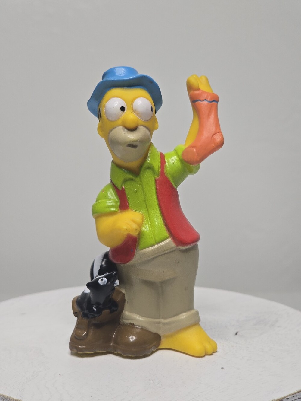 1990 Homer Simpson Camping Holding A Sock Next To A Skunk Figure Collectible